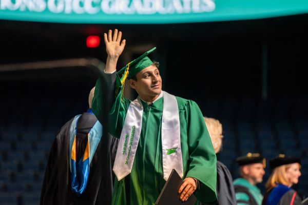 First generation college student/graduate walks across the stage at GTCC’s 11 a.m. 58th annual commencement exercise at the Greensboro Coliseum.