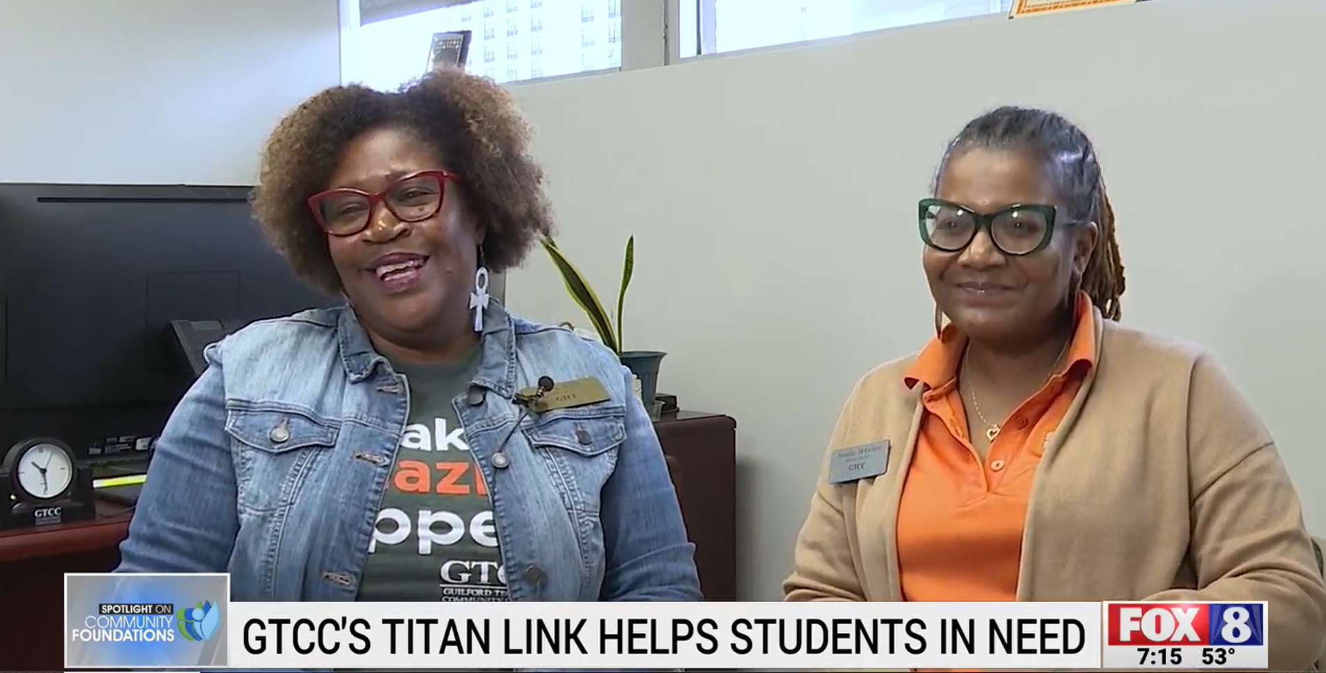 Two women at GTCC talking about Titan Link, a student help service.