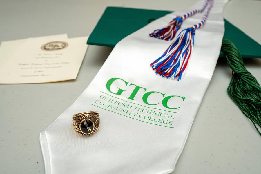 Graduation items available at the GTCC bookstore include invitations, mortar boards, tassels, rings, and stoles.