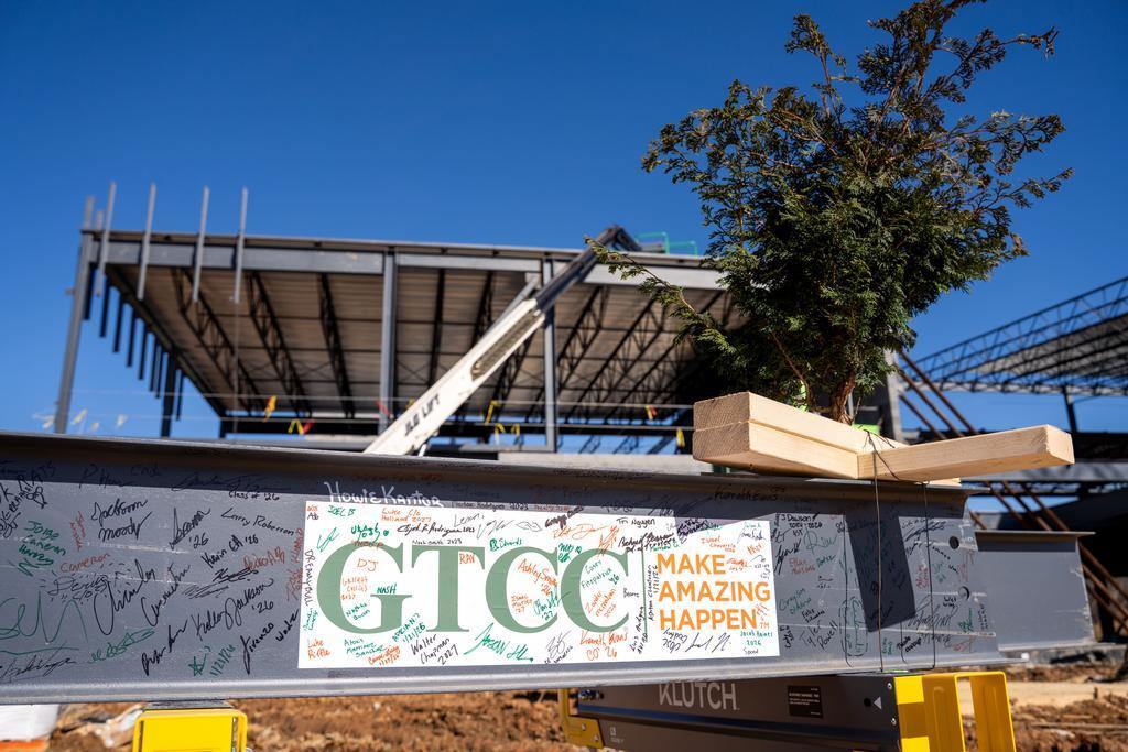 Blum construction putting the final beam on the GTCC Aviation Center