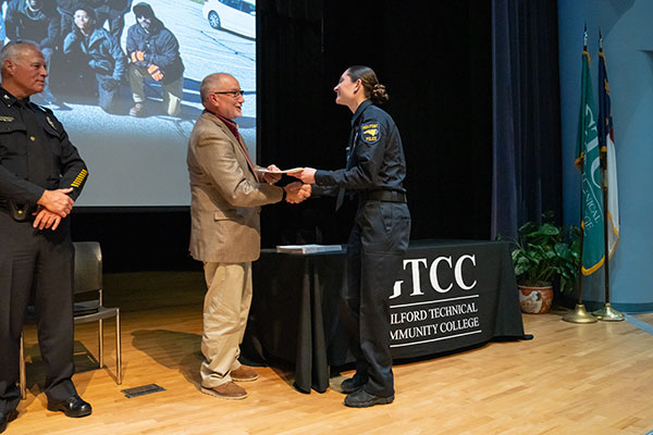 GTCC BLET student at graduation receiving a certificate