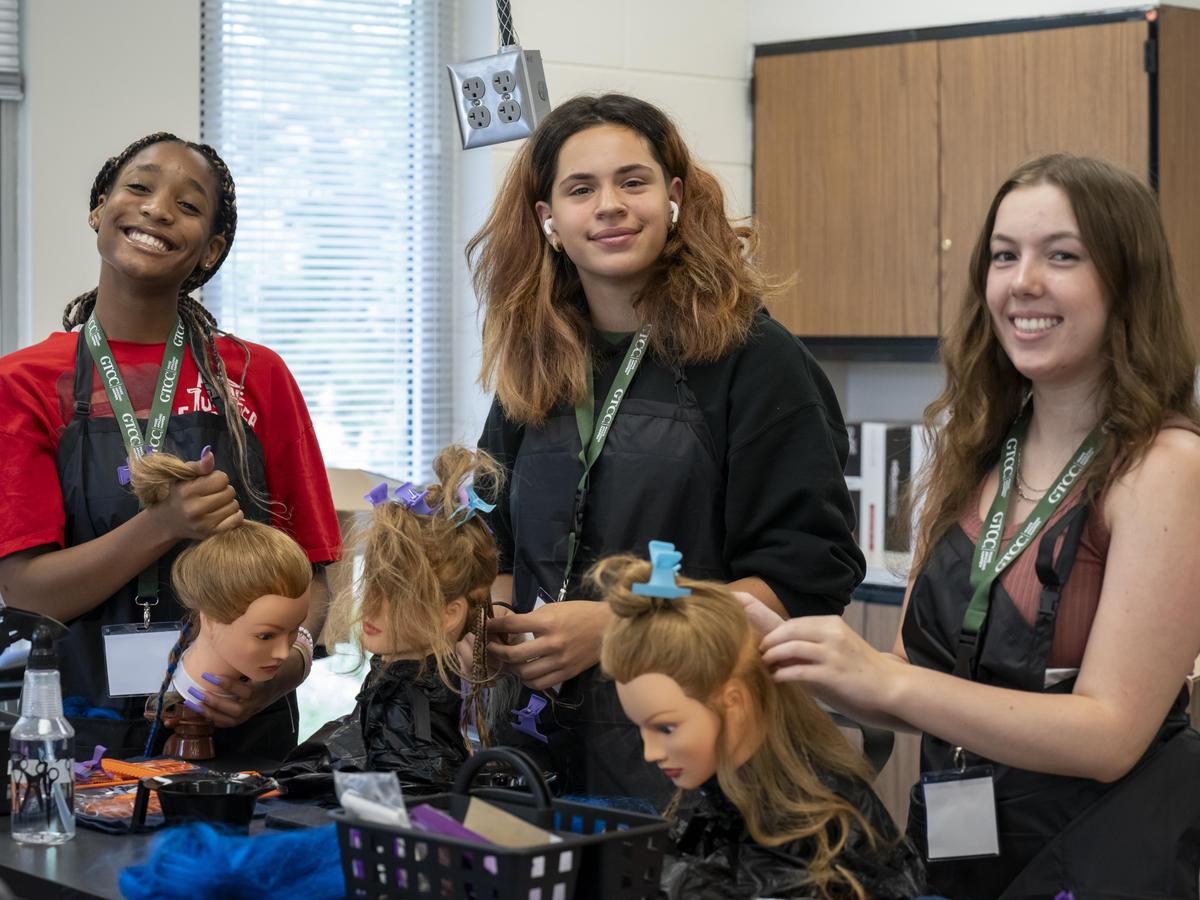 Students learn braiding in Beauty Boldness.