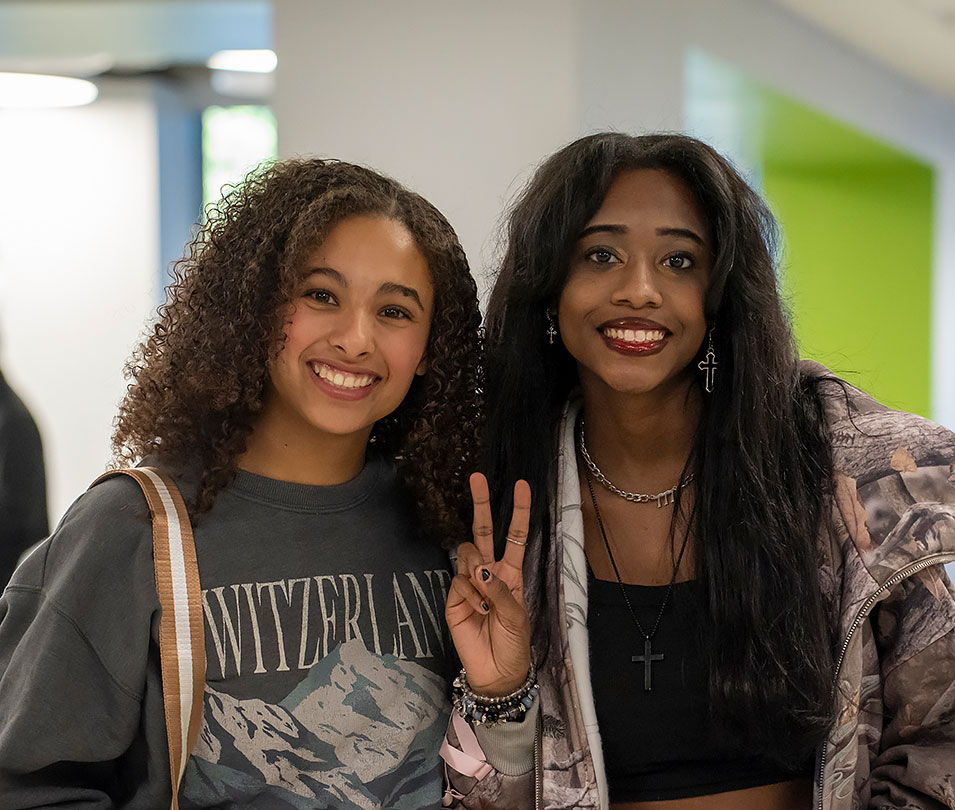 Two female students pose for the camera during welcome week.