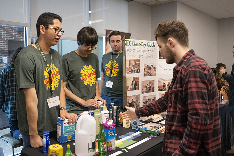Chemistry students explain their exhibit at the 2024 Student Presentation Day.