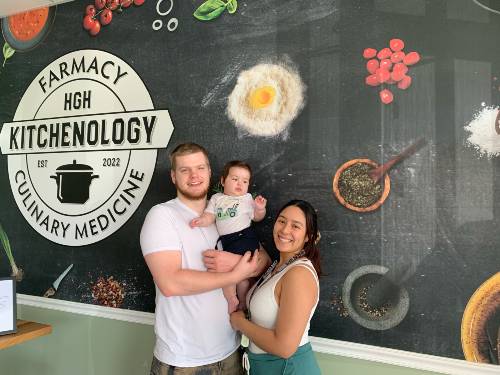 GTCC paralegal student Tania Cerna with her husband and son. 