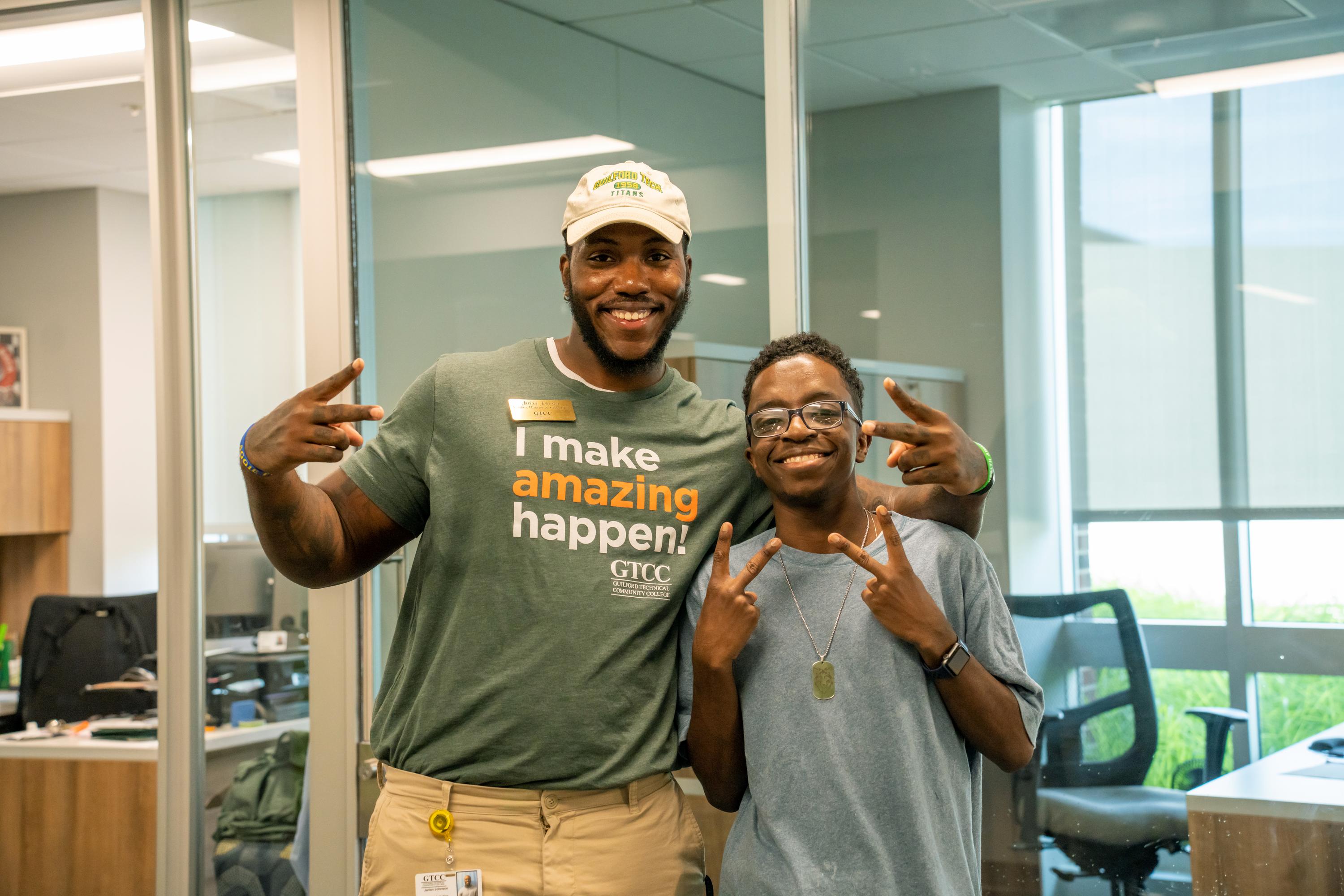 Jarian Johnson poses with Emmanuel Idowu, vice president of the Student Government Association. Johnson is also the staff leader of SGA.