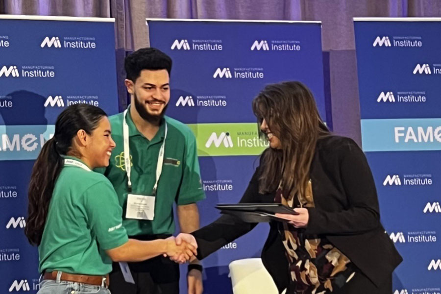 Shackti Martinez (left) and Muhammad Abu Khass (center) accept an award during the national Federation for Advanced Manufacturing Education (FAME) USA conference in Fort Worth, Texas.
