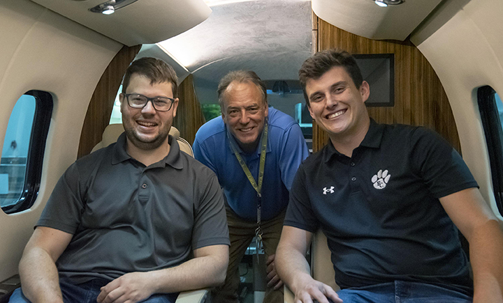 From left: Avionics student Bradley McBride, GTCC avionics instructor Bill Kluepfel (center), and avionics student Tyler Powell.