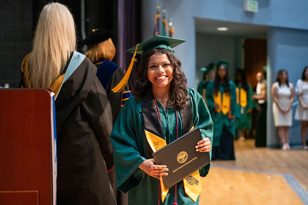 With resilience, strength, and hope, early middle college student graduates with high school diploma and associate degree after cancer battle